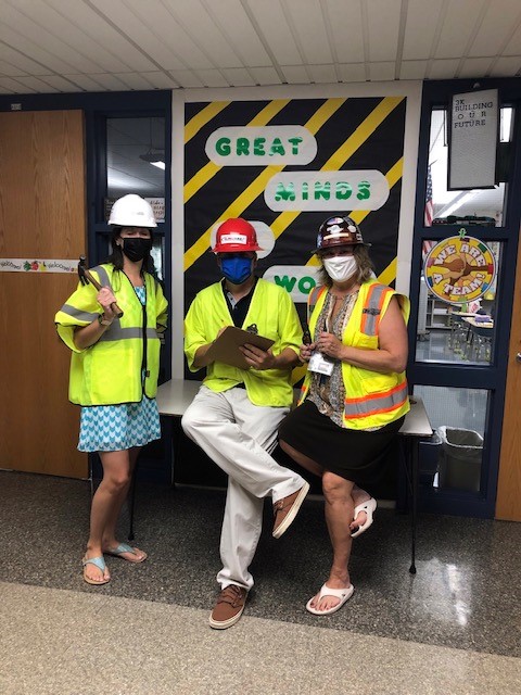 teachers dressed in construction gear